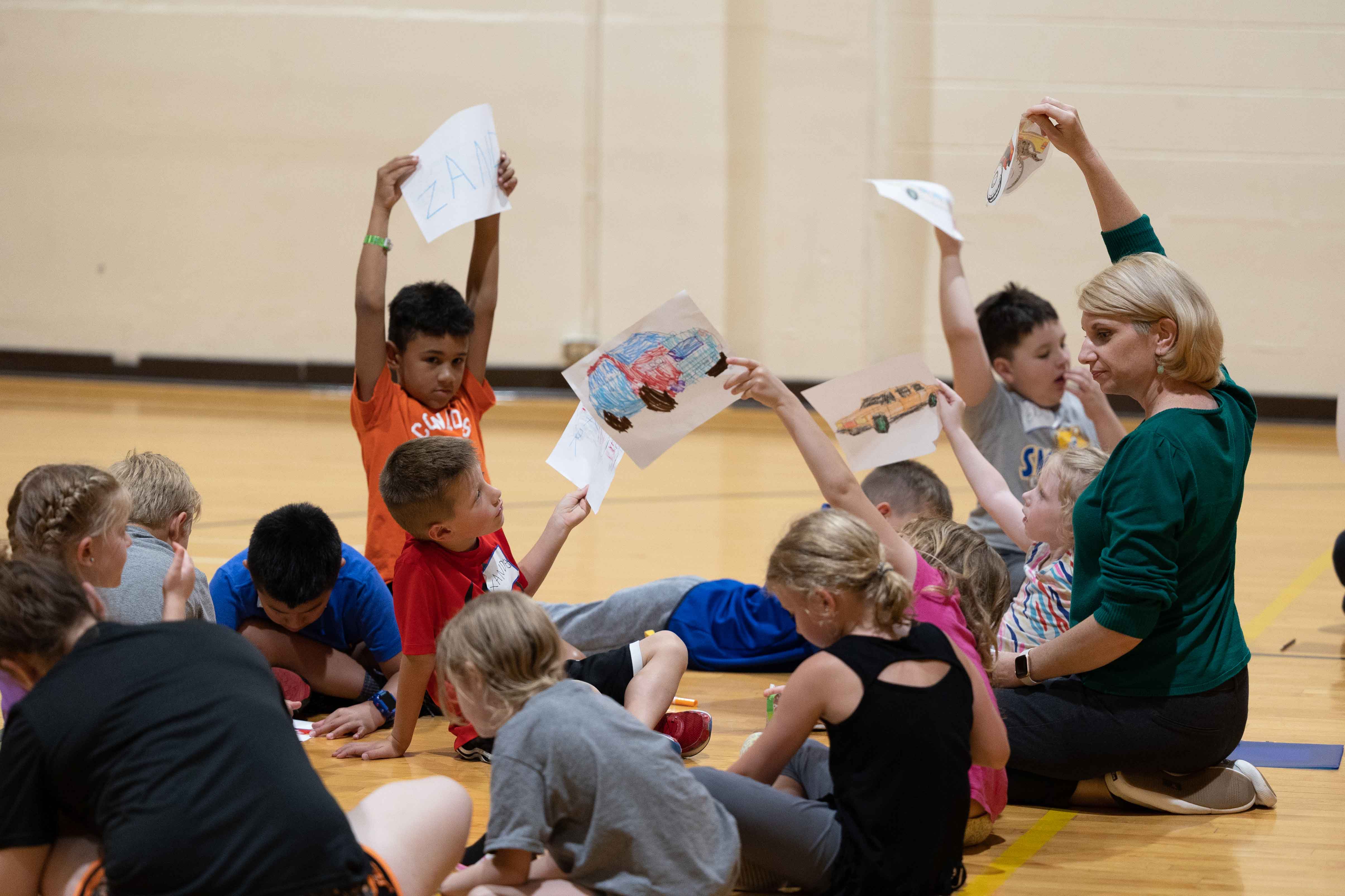 campers showing their drawings