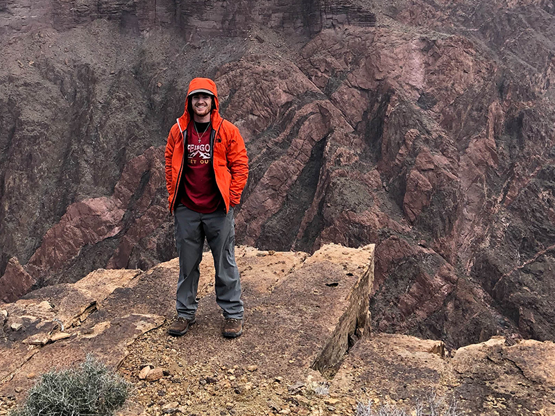 Student on mountain top Student on mountain top