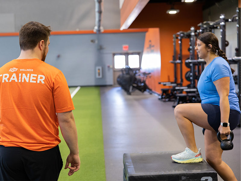 Woman training with trainer in the MAC Gym Woman training with trainer in the MAC Gym